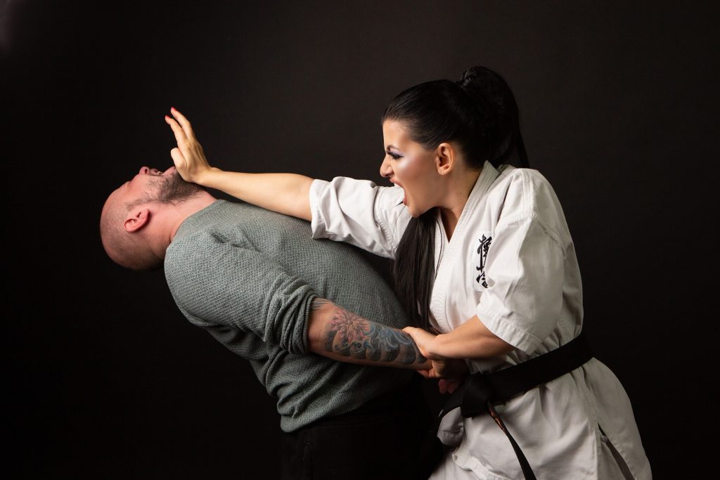 Female Karateka using the principle of ‘kime’ when defending herself from a male attacker